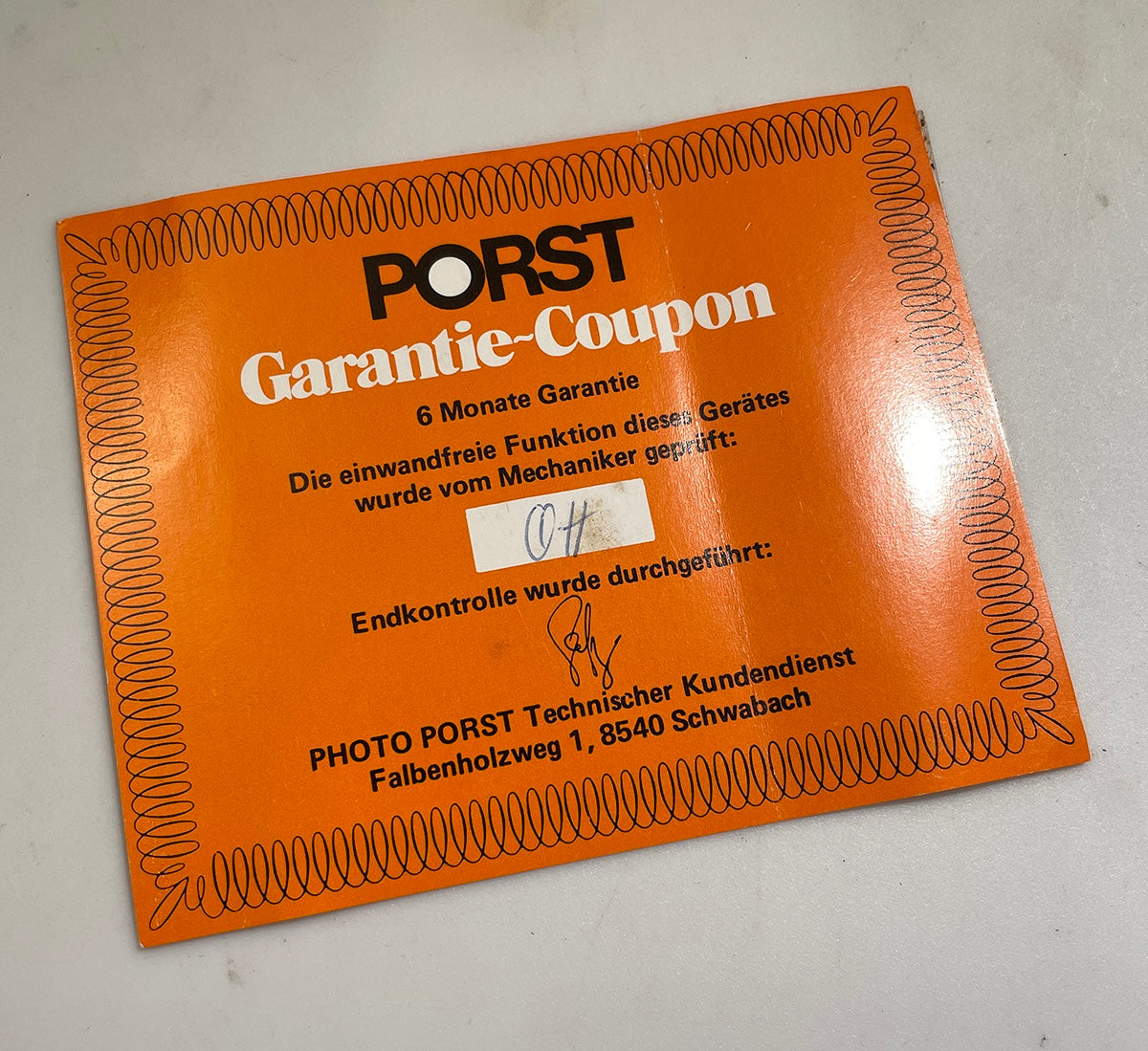 40111 | SX-70_box porst keystone warranty card german